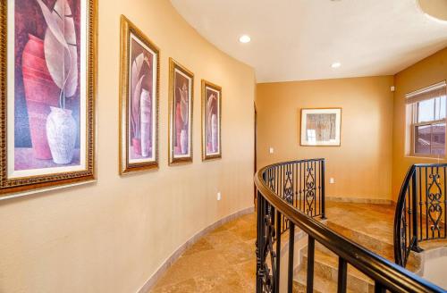 a staircase in a home with paintings on the wall at Spectacular 3BR 3BA San Felipe Villa with WiFi Free Golf in San Felipe