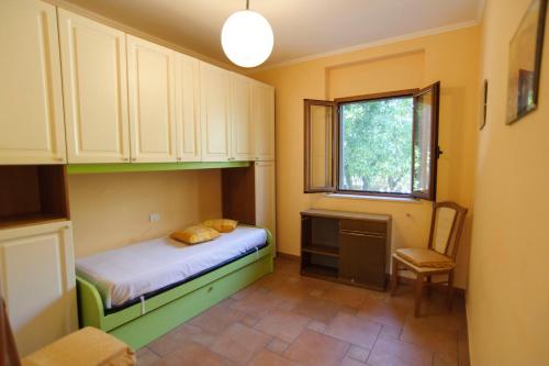 En eller flere senge i et værelse på Villa Carmine
