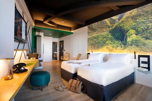 Una cama o camas en una habitación de Boutique Hôtel Kon Tiki Tahiti