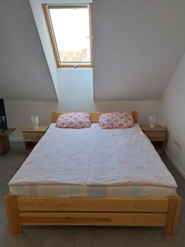 A bed or beds in a room at Atkacs Home
