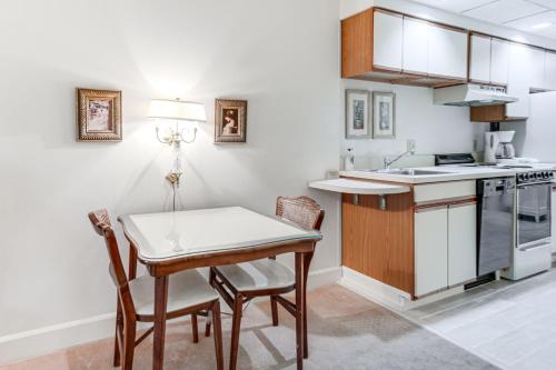 a kitchen with a table and chairs and a sink at Experience Chautauqua! Newly Renovated Studio in Chautauqua