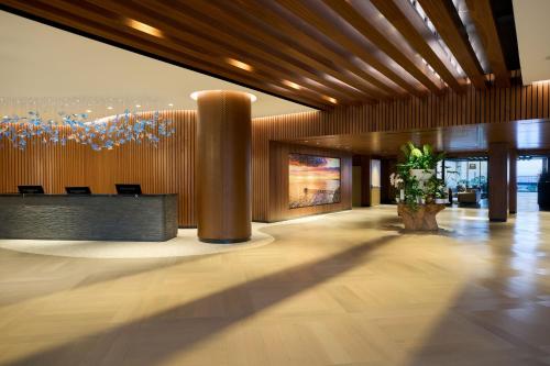a lobby with a reception desk in a building at VEA Newport Beach, a Marriott Resort & Spa in Newport Beach