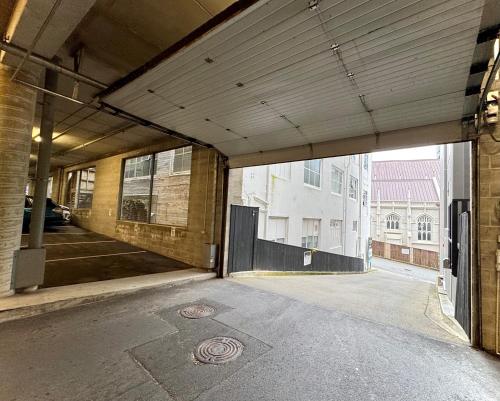 an empty building with an open door to a street at Boulcott Suites in Wellington