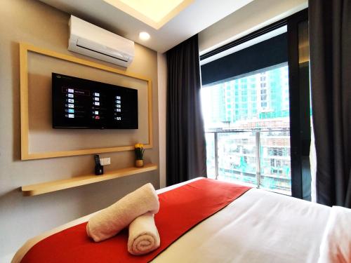 a hotel room with a bed and a large window at Genting RefreshingColdInn2R1B AT Ion Delemen in Genting Highlands