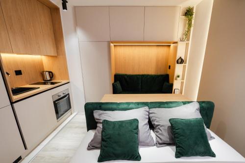 a small apartment with a bed and a kitchen at Studio Compact in Doboj