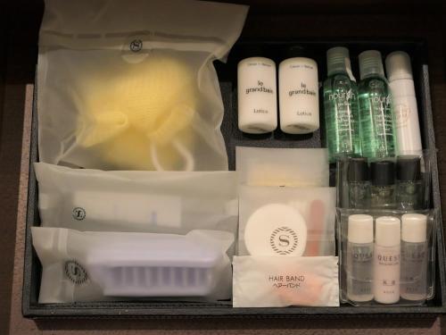 a drawer filled with cosmetics and other items at Yokohama Bay Sheraton Hotel and Towers in Yokohama