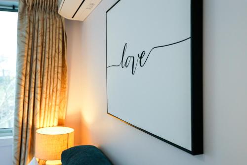 a living room with a mirror and a lamp at Bright Modern Holiday Home 7 Beds at Doncaster in Doncaster