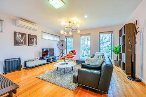 a living room with a couch and a table at Bright Modern Holiday Home 7 Beds at Doncaster in Doncaster