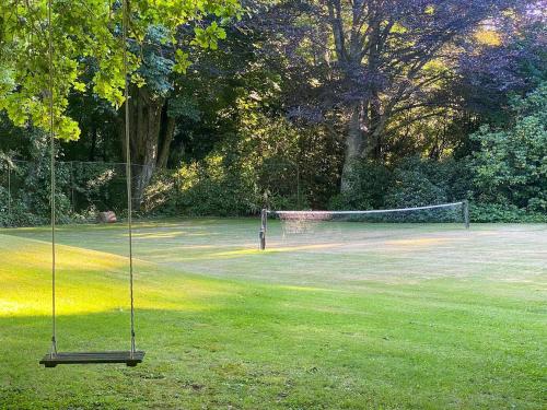 a net in the middle of a field with a goal at The Rabbiter's Cottage in Kahuranaki