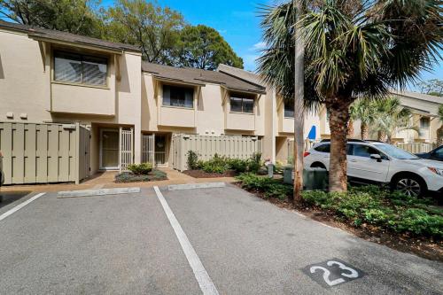 a car parked in a parking lot in front of a building at EZ Beach Access - 2 Bed 2 and one half Bath 23 Coligny Villa in Hilton Head Island