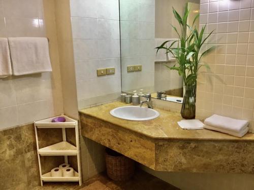 a bathroom with a sink and a mirror at 3BR Condo in Rawai, Phuket with Exclusive Beach in Ban Saiyuan (1)