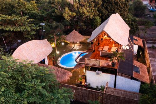 an aerial view of a resort with a swimming pool at Villa Samyama in Gili Air