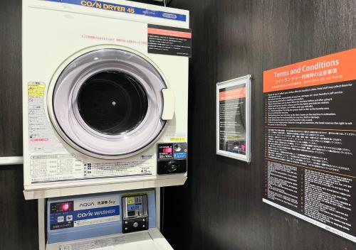 a washing machine is on display in a store at APA Hotel Kobe Sannomiya in Kobe