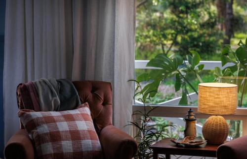 a living room with a chair and a window at Poppy's Place - Denmark in Denmark