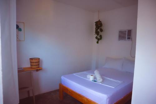 Postel nebo postele na pokoji v ubytování Camotes Hostel Resort