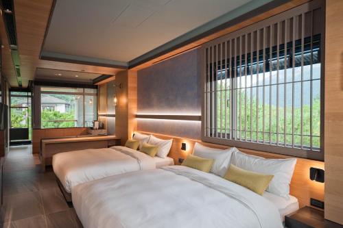 Postel nebo postele na pokoji v ubytování 埔里春天度假村 Spring resort