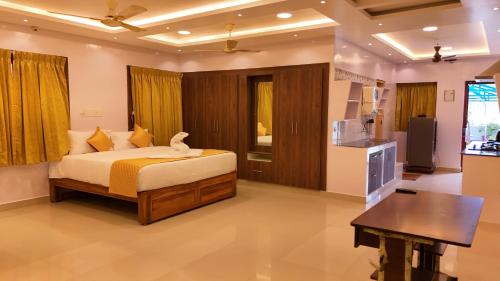 a bedroom with a bed with a bird on it at Golden Dawn Residency in Tiruvannāmalai