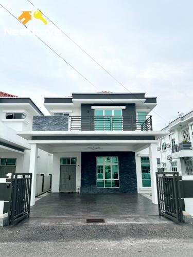 a house with a driveway in front of it at Klebang 7 Spacious Luxury 6BR Villa By Nestcove in Melaka