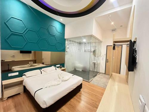 Postel nebo postele na pokoji v ubytování Smile Hotel Wangsa Maju