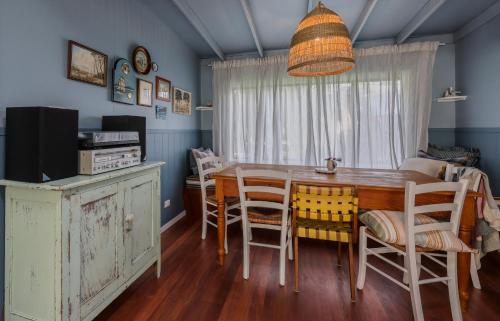a dining room with a table and chairs at Poppy's Place - Denmark in Denmark