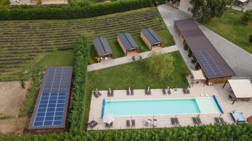 an overhead view of a swimming pool with solar panels at LA CASCINA DI CARLOTTA 1846 agriturismo in Alba