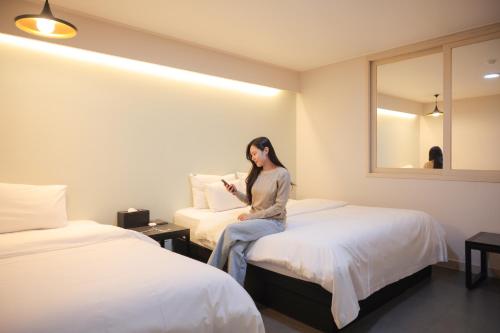 Postel nebo postele na pokoji v ubytování VIP Hotel Mokpo