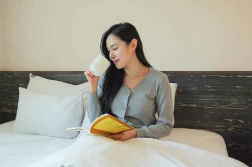Postel nebo postele na pokoji v ubytování VIP Hotel Mokpo