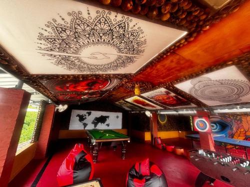 a room with a ping pong table and a ceiling at Casa Branca Retreat in Varkala