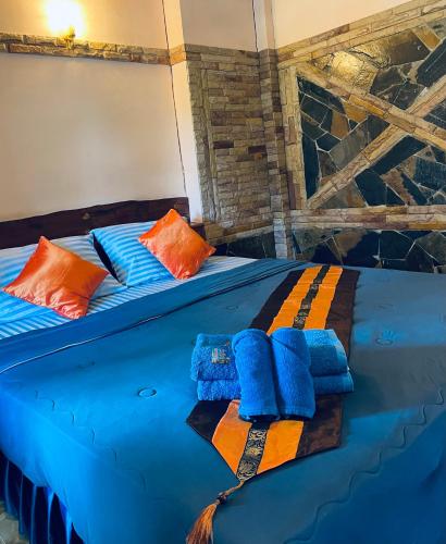 Letto o letti in una camera di Markhouse Bungalow Ko Kut
