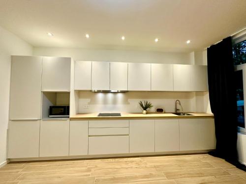 Η κουζίνα ή μικρή κουζίνα στο Luxury Suites Park by Rikas Hotels