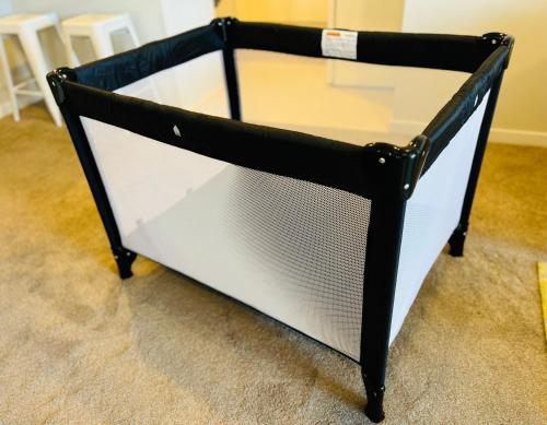 a black and white coffee table with a glass top at Cozy Home in Central Millwater in Auckland
