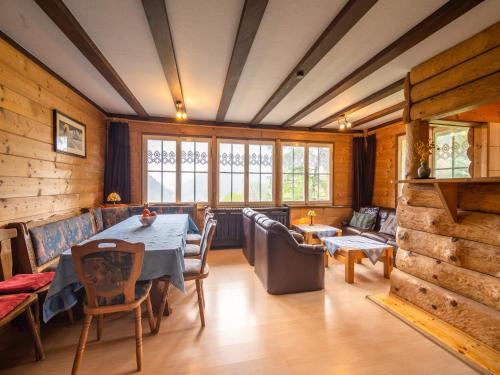 a dining room with a table and chairs at Wald-Wohnung in Todtmoos in Todtmoos