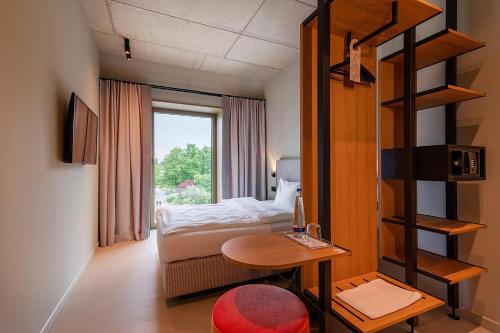 Postel nebo postele na pokoji v ubytování MIANO Hotel & Bar