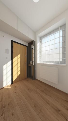 an empty room with a door and a window at COZY CENTRAL Apartment in Dolný Kubín