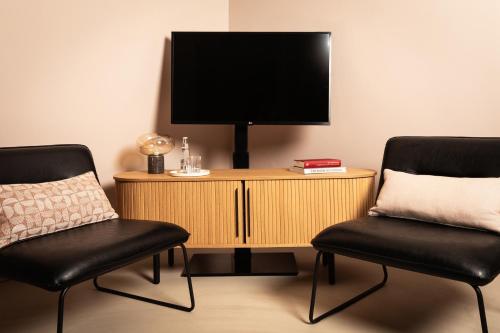 MIANO Hotel & Barにあるテレビまたはエンターテインメントセンター