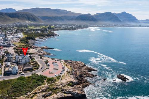 an aerial view of a beach and the ocean at Hermanus Luxury Penthouse in Hermanus