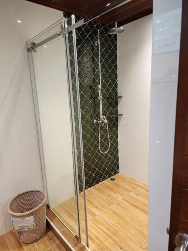 a shower with a glass door in a bathroom at Phi Phi Natural Resort in Phi Phi Don