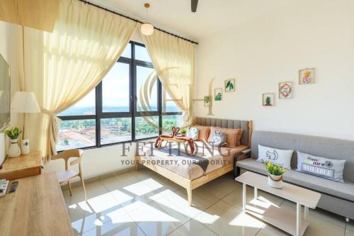 a living room with a couch and a large window at IOICityMall #Muji#Tatami#Babycot#Conezion#New in Kampong Abu Bakar