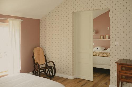 a bedroom with a bed and a mirror at Domaine de Bassibé in Ségos