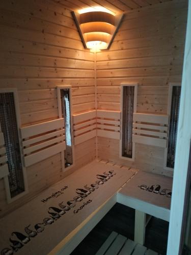 a room with a sauna in a cabin at Villa Garden in Bešeňová