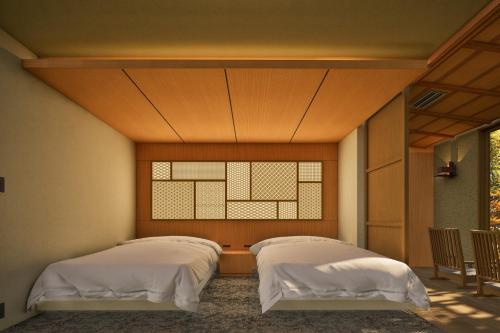 Un ou plusieurs lits dans un hébergement de l'établissement Jinya Ryokan