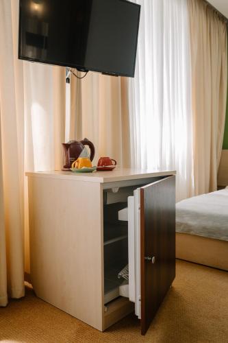 Ένα ή περισσότερα κρεβάτια σε δωμάτιο στο 7 Days Hotel Kamyanets-Podilskyi