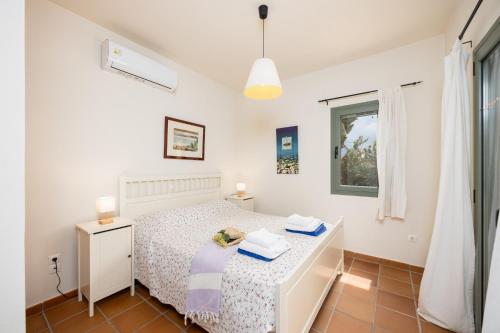Ένα ή περισσότερα κρεβάτια σε δωμάτιο στο Villa Ionian Rose