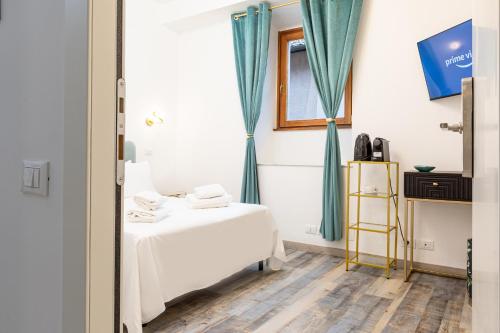 Uma cama ou camas num quarto em Il Monastero Collection