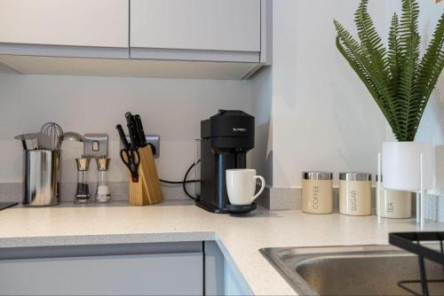 a kitchen counter with a coffee maker on the counter at Warrington - House - Sleeps 6 - Parking - Garden in Warrington