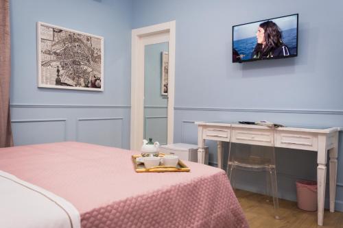 Postel nebo postele na pokoji v ubytování Palazzo Rosso