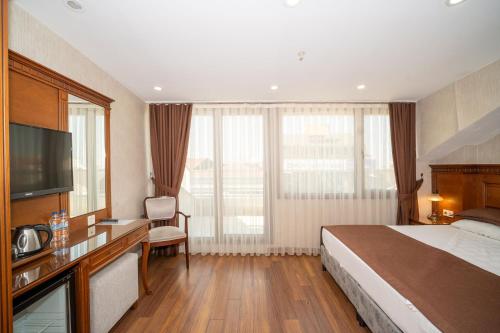 Ένα ή περισσότερα κρεβάτια σε δωμάτιο στο Hotel Blisstanbul