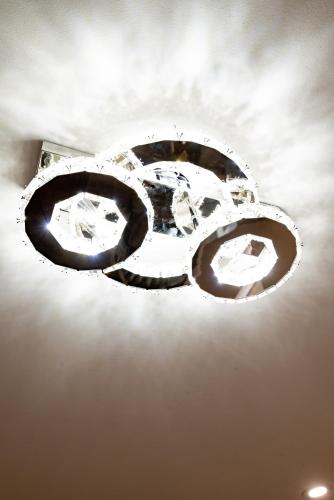 a chandelier hanging from the ceiling of a room at G O G Building in Darby