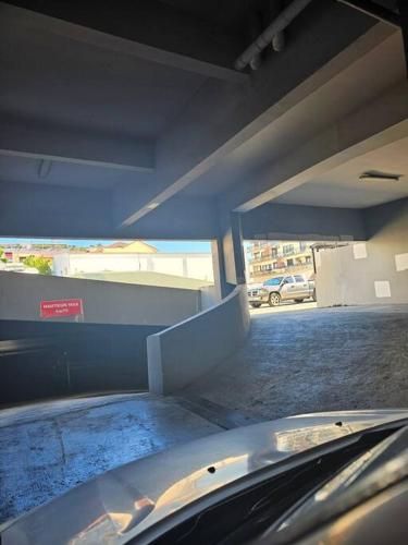 a car is parked in a parking garage at F2en duplex tout équipé arrivée autonome in Noumea