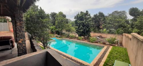 an overhead view of a swimming pool in a yard at Kili Kivuli in Msaranga